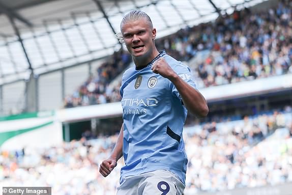 MANCHESTER, ENGLAND - AUGUST 24: Erling Haaland of Manchester City celebrates after scoring his side's first goal from the penalty spot during the Premier League match between Manchester City FC and Ipswich Town FC at Etihad Stadium on August 24, 2024 in Manchester, England. (Photo by James Gill - Danehouse/Getty Images)