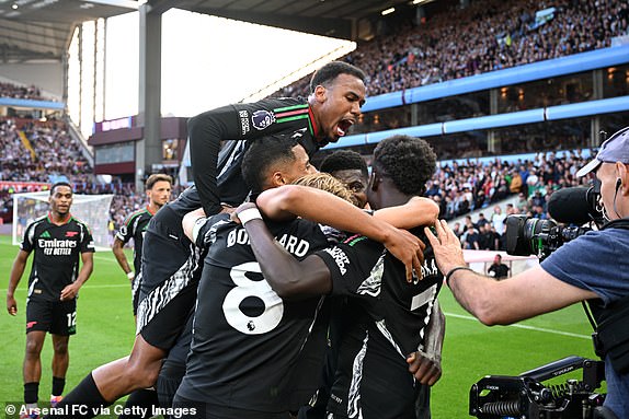 BIRMINGHAM, ENGLAND - AUGUST 24: Thomas Partey of Arsenal celebrates scoring his team's second goal with teammates during the Premier League match between Aston Villa FC and Arsenal FC at Villa Park on August 24, 2024 in Birmingham, England. (Photo by Stuart MacFarlane/Arsenal FC via Getty Images)