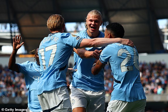 MANCHESTER, ENGLAND - AUGUST 24: Kevin De Bruyne of Manchester City celebrates scoring his side's second goal with team-matea Savinho and Erling Haaland during the Premier League match between Manchester City FC and Ipswich Town FC at Etihad Stadium on August 24, 2024 in Manchester, England. (Photo by Chris Brunskill/Fantasista/Getty Images)