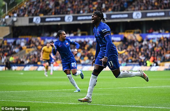 WOLVERHAMPTON, ENGLAND - AUGUST 25: Noni Madueke of Chelsea celebrates scoring his team's third goal during the Premier League match between Wolverhampton Wanderers FC and Chelsea FC at Molineux on August 25, 2024 in Wolverhampton, England. (Photo by Shaun Botterill/Getty Images)