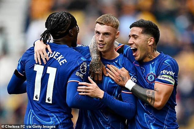 All of Madueke's goals on Sunday were assisted by Chelsea team-mate Cole Palmer (centre)