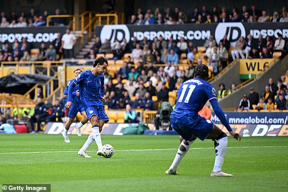 WOLVERHAMPTON, ENGLAND - AUGUST 25: Joao Felix of Chelsea scores his team's sixth goal during the Premier League match between Wolverhampton Wanderers FC and Chelsea FC at Molineux on August 25, 2024 in Wolverhampton, England. (Photo by Shaun Botterill/Getty Images)