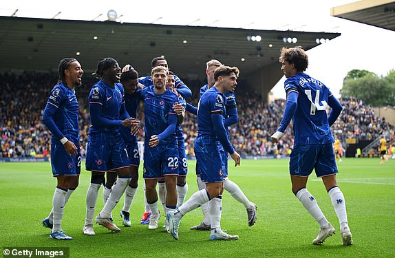 WOLVERHAMPTON, ENGLAND - AUGUST 25: Joao Felix of Chelsea celebrates scoring his team's sixth goal with teammates during the Premier League match between Wolverhampton Wanderers FC and Chelsea FC at Molineux on August 25, 2024 in Wolverhampton, England. (Photo by Shaun Botterill/Getty Images)