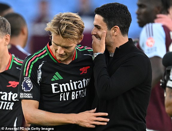 BIRMINGHAM, ENGLAND - AUGUST 24: Arsenal manager Mikel Arteta with captaain Martin Odegaard after the Premier League match between Aston Villa FC and Arsenal FC at Villa Park on August 24, 2024 in Birmingham, England. (Photo by Stuart MacFarlane/Arsenal FC via Getty Images)