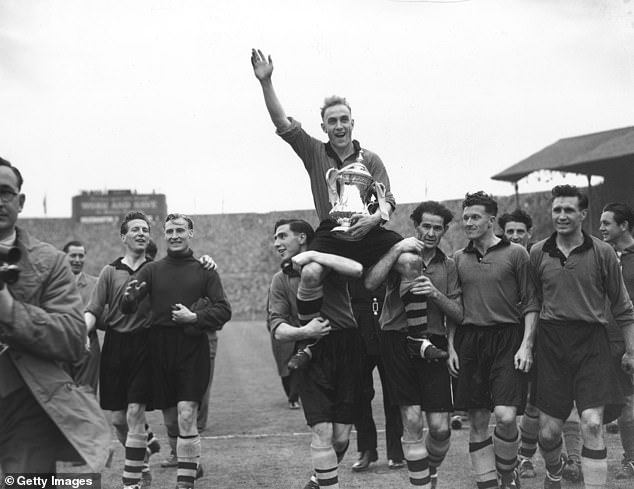 Billy Wright celebrates with his Wolves team-mates after guiding them to the 1949 FA Cup