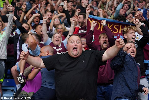 Aston Villa supporters pictured celebrating during Saturday's win at the King Power Stadium