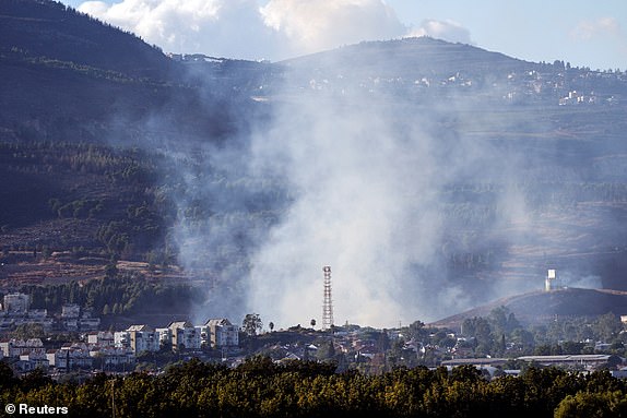 Smoke rises above Kiryat Shmona after rockets were fired from Lebanon towards Israel, amid cross-border hostilities between Hezbollah and Israel, as seen from northern Israel September 18, 2024. REUTERS/Ayal Margolin ISRAEL OUT. NO COMMERCIAL OR EDITORIAL SALES IN ISRAEL