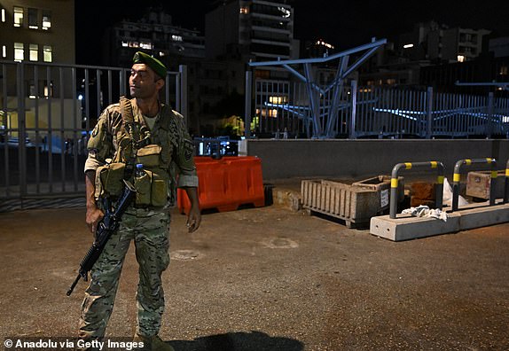 BEIRUT, LEBANON - SEPTEMBER 18: Lebanese soldiers, taking precautions in the area after a new wave of wireless communications device explosions across the country, controlled a detonation of a device they suspected to be rigged with explosives in a pit at the parking lot of the American University of Beirut Medical Center where the injured were brought in Lebanon on September 18, 2024. (Photo by Houssam Shbaro/Anadolu via Getty Images)