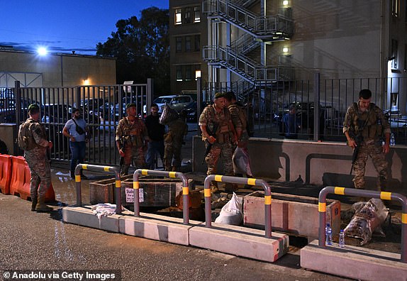 BEIRUT, LEBANON - SEPTEMBER 18: Lebanese soldiers, taking precautions in the area after a new wave of wireless communications device explosions across the country, controlled a detonation of a device they suspected to be rigged with explosives in a pit at the parking lot of the American University of Beirut Medical Center where the injured were brought in Lebanon on September 18, 2024. (Photo by Houssam Shbaro/Anadolu via Getty Images)