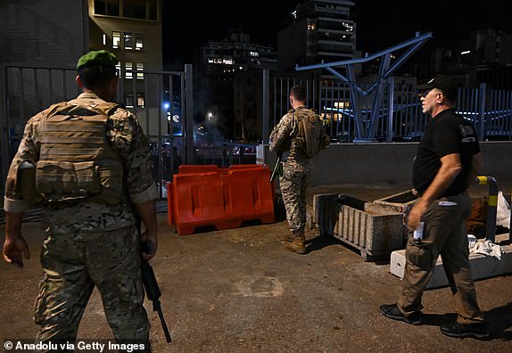 BEIRUT, LEBANON - SEPTEMBER 18: Lebanese soldiers, taking precautions in the area after a new wave of wireless communications device explosions across the country, controlled a detonation of a device they suspected to be rigged with explosives in a pit at the parking lot of the American University of Beirut Medical Center where the injured were brought in Lebanon on September 18, 2024. (Photo by Houssam Shbaro/Anadolu via Getty Images)