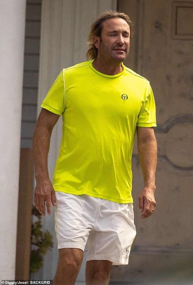 Crabb was seen making his way around the vicinity in a neon yellow sports top and light khaki shorts