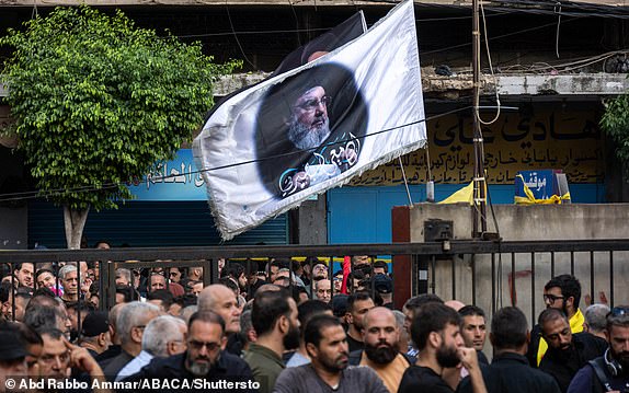 Mandatory Credit: Photo by Abd Rabbo Ammar/ABACA/Shutterstock (14727975b) Portrait of Hassan Nasrallah seen during funeral organized by Hezbollah for four victims killed in the explosions of pagers or paging devices in an unprecedented attack on Lebanon and Syria, in Ghobeiri area, in Beirut's southern suburb, Lebanon, on September 18, 2024. Pagers Attack Victims Funeral By Hezbollah - Beirut, Lebanon - 18 Sep 2024