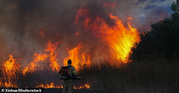 Mandatory Credit: Photo by Xinhua/Shutterstock (14727694d) A firefighter battles a fire following a rocket attack from Lebanon, in Kiryat Shmona, northern Israel, on Sept. 18, 2024. Israeli Defense Minister Yoav Gallant said on Wednesday that Israel has entered a "new phase" in its conflict with Hezbollah in Lebanon, following two days of explosions targeting communication devices across Lebanon. Israel Kiryat Shmona Rocket Attack - 18 Sep 2024