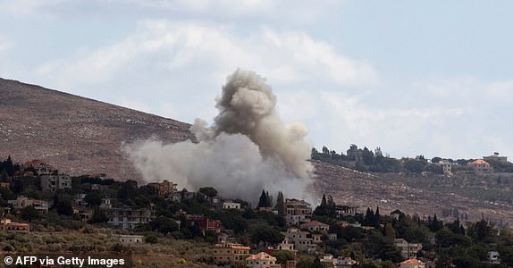 Smoke billows from the site of an Israeli airstrike that targeted an area in the southern Lebanese village of al-Taybeh on September 19, 2024. Lebanon's Hezbollah has traded near-daily fire with Israeli forces in support of ally Hamas since the Palestinian militant group's October 7 attack triggered war in the Gaza Strip, with repeated escalations during more than 11 months of the cross-border violence. (Photo by AMMAR AMMAR / AFP) (Photo by AMMAR AMMAR/AFP via Getty Images)