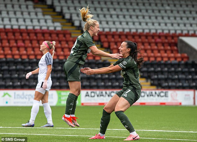 Agnew celebrates with Amy Gallacher after her goal edged Celtic closer to the big time