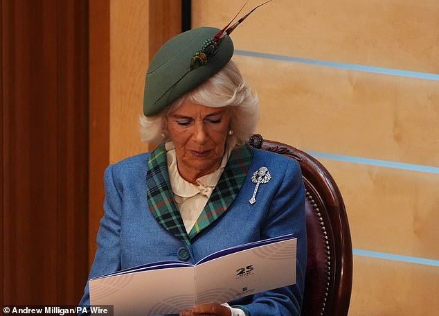 Her Majesty's brooch took the shape of a thistle and the feathers in her hat were reminiscent of a salmon fly fishing knot known as The Lang Syne