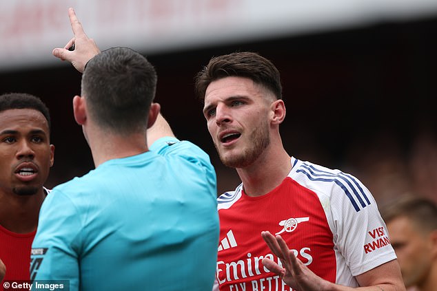 Declan Rice (right) has also received a second booking for 'delaying the restart' this season