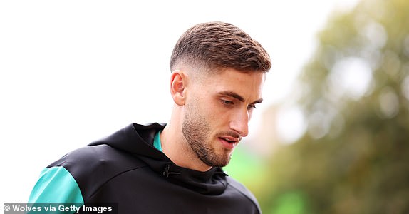 WOLVERHAMPTON, ENGLAND - SEPTEMBER 28: Santiago Bueno of Wolverhampton Wanderers arrives at the stadium ahead of the Premier League match between Wolverhampton Wanderers FC and Liverpool FC at Molineux on September 28, 2024 in Wolverhampton, England. (Photo by Jack Thomas - WWFC/Wolves via Getty Images)