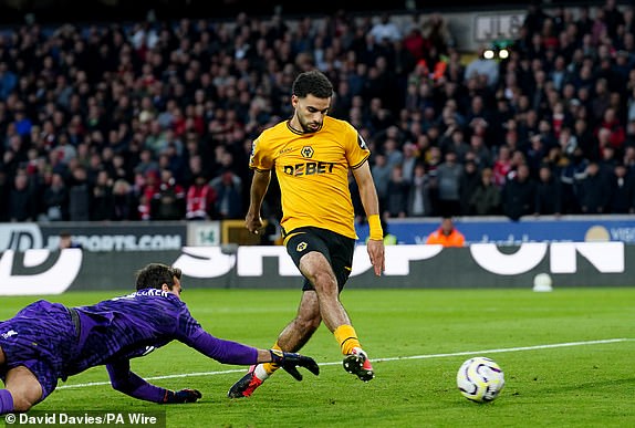 Wolverhampton Wanderers' Rayan Ait-Nouri scores their side's first goal of the game during the Premier League match at Molineux Stadium, Wolverhampton. Picture date: Saturday September 28, 2024. PA Photo. See PA story SOCCER Wolves. Photo credit should read: David Davies/PA Wire.RESTRICTIONS: EDITORIAL USE ONLY No use with unauthorised audio, video, data, fixture lists, club/league logos or "live" services. Online in-match use limited to 120 images, no video emulation. No use in betting, games or single club/league/player publications.