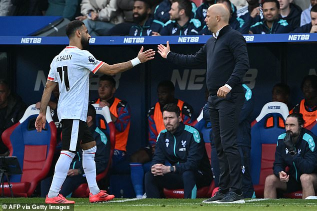 Salah (left) touched the ball 33 times before he was taken off by manager Arne Slot (right)