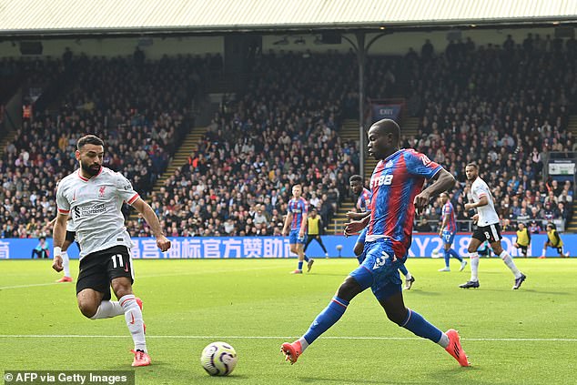 No 3 Tyrick Mitchell had a tough afternoon, although he put in a solid shift against Salah (left)