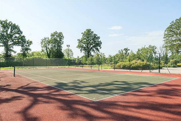 Leisure facilities extend outside with an enclosed flood lit tennis court and mini football pitch