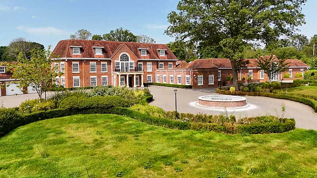 The Georgian style property sits on 9.12 acres of gated grounds and includes a garage for six cars