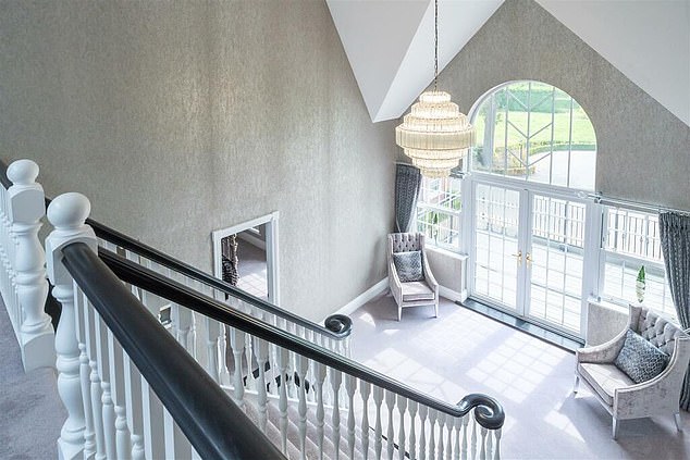 A description of the property on Rightmove said: 'On entering you are aware that this is no ordinary home, the reception hall is vast with a central split flight staircase to the first and second floor.'