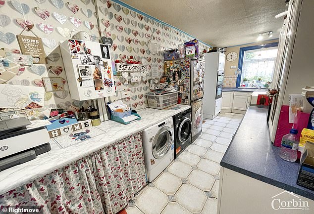 The kitchen of the property where the boiler is plastered with stickers of Elvis Presley