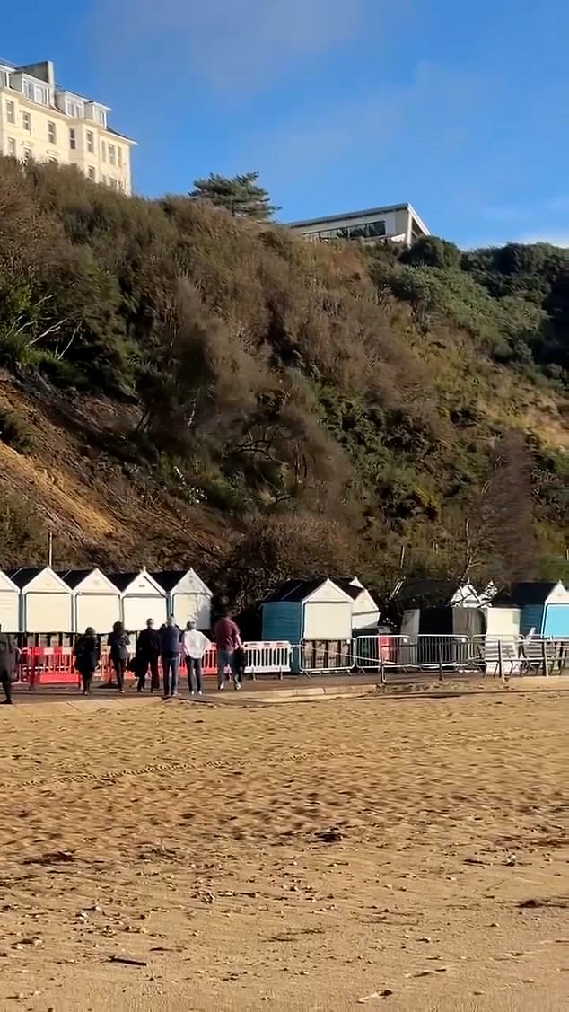 The chunk of dirt was caught on camera sliding from the cliff on Saturday morning