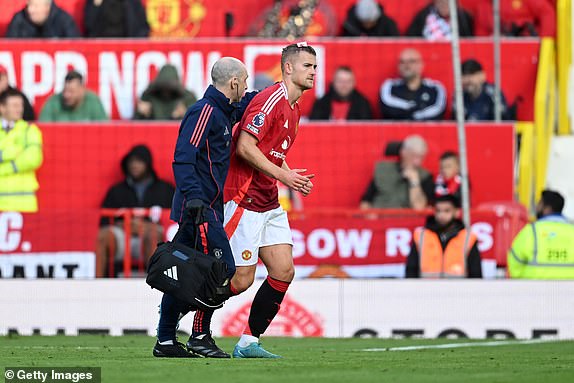 MANCHESTER, ENGLAND - OCTOBER 19: Matthijs de Ligt of Manchester United leaves the pitch injured during the Premier League match between Manchester United FC and Brentford FC at Old Trafford on October 19, 2024 in Manchester, England. (Photo by Michael Regan/Getty Images)