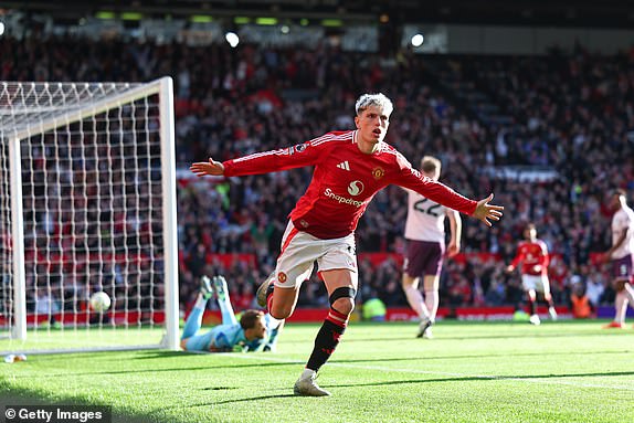 MANCHESTER, ENGLAND - OCTOBER 19: Alejandro Garnacho of Manchester United celebrates after scoring a goal to make it 1-1 during the Premier League match between Manchester United FC and Brentford FC at Old Trafford on October 19, 2024 in Manchester, England. (Photo by Robbie Jay Barratt - AMA/Getty Images)