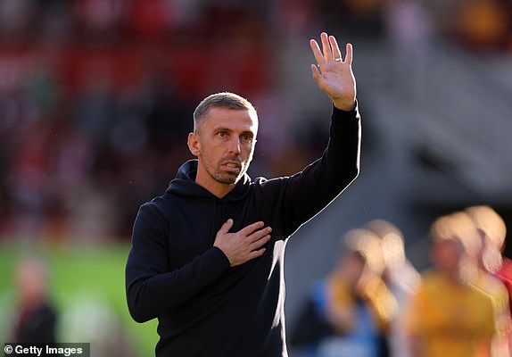 BRENTFORD, ENGLAND - OCTOBER 05: Gary O'Neil manager / head coach of Wolverhampton Wanderers acknowledges the fans and holds his hands up after the Premier League match between Brentford FC and Wolverhampton Wanderers FC at Gtech Community Stadium on October 05, 2024 in Brentford, England. (Photo by Catherine Ivill - AMA/Getty Images)