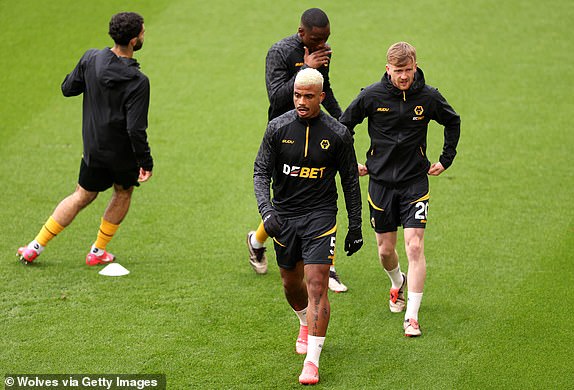 WOLVERHAMPTON, ENGLAND - OCTOBER 20: Mario Lemina and Tommy Doyle of Wolverhampton Wanderers warm up prior to the Premier League match between Wolverhampton Wanderers FC and Manchester City FC at Molineux on October 20, 2024 in Wolverhampton, England. (Photo by Jack Thomas - WWFC/Wolves via Getty Images)