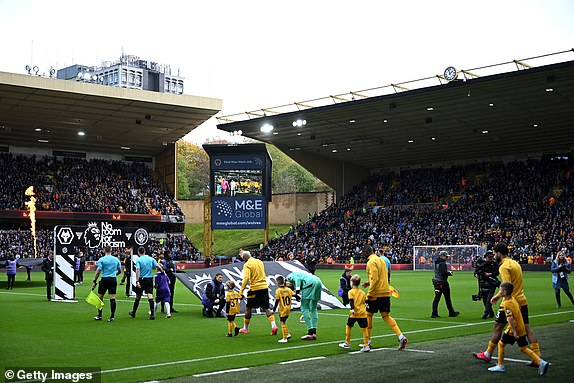 WOLVERHAMPTON, ENGLAND - OCTOBER 20: A general view of a 'No Room For Racism' handshake board and flag as both teams walk out prior to the Premier League match between Wolverhampton Wanderers FC and Manchester City FC at Molineux on October 20, 2024 in Wolverhampton, England. (Photo by Shaun Botterill/Getty Images)