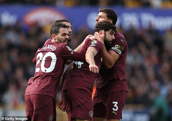 WOLVERHAMPTON, ENGLAND - OCTOBER 20: Josko Gvardiol of Manchester City celebrates scoring his team's first goal with teammates during the Premier League match between Wolverhampton Wanderers FC and Manchester City FC at Molineux on October 20, 2024 in Wolverhampton, England. (Photo by Ryan Pierse/Getty Images)