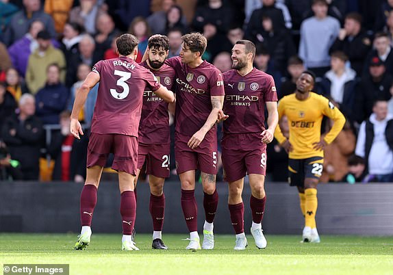 WOLVERHAMPTON, ENGLAND - OCTOBER 20: Josko Gvardiol of Manchester City celebrates with team mates after scoring a goal to make it 1-1 during the Premier League match between Wolverhampton Wanderers FC and Manchester City FC at Molineux on October 20, 2024 in Wolverhampton, England. (Photo by Catherine Ivill - AMA/Getty Images)