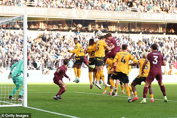 WOLVERHAMPTON, ENGLAND - OCTOBER 20: John Stones of Manchester City scores the winning goal in injury time during the Premier League match between Wolverhampton Wanderers FC and Manchester City FC at Molineux on October 20, 2024 in Wolverhampton, England. (Photo by Marc Atkins/Getty Images)