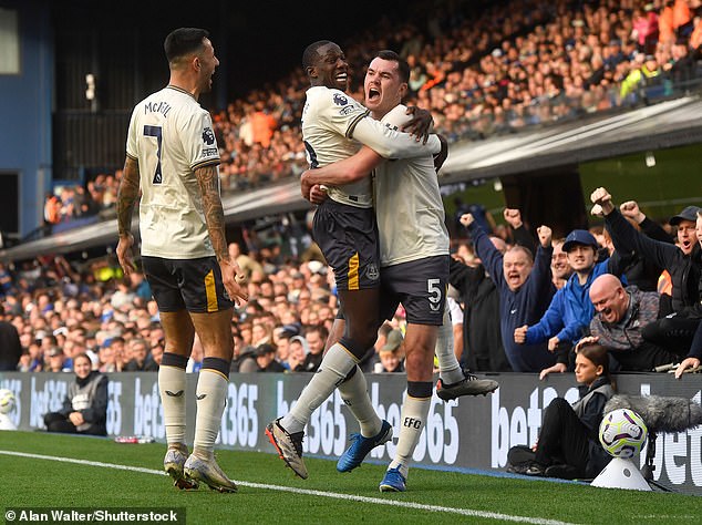 McNeil (left) - who played in a No 10 role - assisted Michael Keane (right) for the second goal