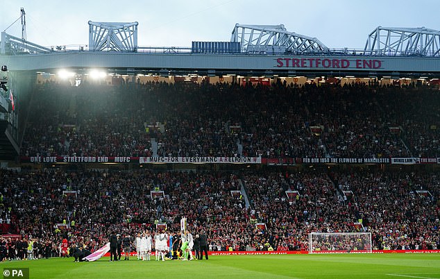 A Manchester United fan has been arrested after a police officer had his hat knocked off in the Stretford End on Saturday