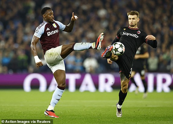 Soccer Football - Champions League - Aston Villa v Bologna - Villa Park, Birmingham, Britain - October 22, 2024 Aston Villa's Jhon Duran in action with Bologna's Stefan Posch Action Images via Reuters/Peter Cziborra