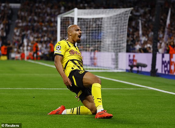 Soccer Football - Champions League - Real Madrid v Borussia Dortmund - Santiago Bernabeu, Madrid, Spain - October 22, 2024 Borussia Dortmund's Donyell Malen celebrates scoring their first goal REUTERS/Susana Vera