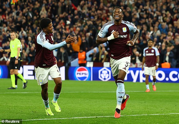 Soccer Football - Champions League - Aston Villa v Bologna - Villa Park, Birmingham, Britain - October 22, 2024 Aston Villa's Jhon Duran celebrates scoring their second goal with Leon Bailey REUTERS/Molly Darlington