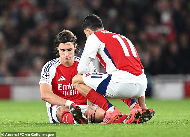 Riccardo Calafiori (left) went down injured after landing awkwardly on his knee