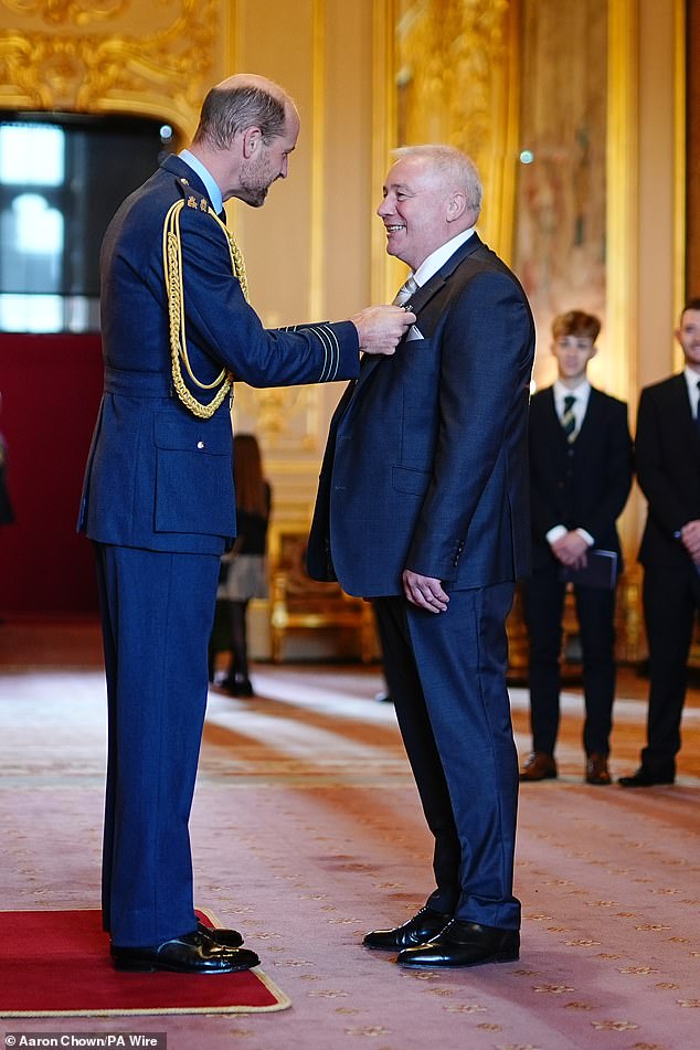 Prince William is pictured honouring Ally McCoist with an OBE for services to football and broadcasting at Windsor Castle on October 2