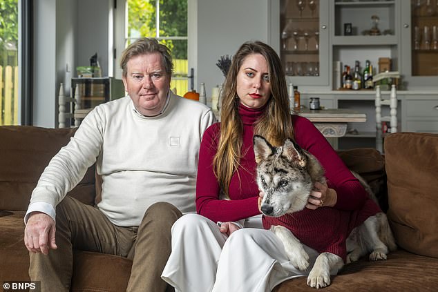 Dominika Sojka, 34, (centre) and her partner Ian Clague, 62, (left) lost their 10-month-old puppy Bijoux on June 29 after he escaped from the garden of their £1million Bournemouth home and was hit by a car. Pictured: Ian and Dominika with Bijoux’s sister Saphir