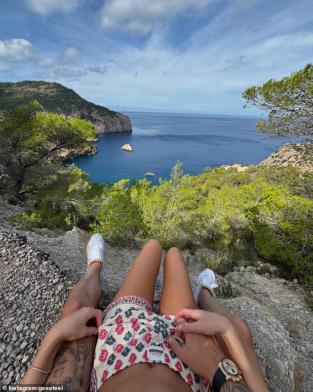 In another snap, Georgia was seen sitting between Harry's legs on a rocky hill