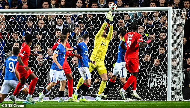 Rangers goalkeeper Jack Butland makes up for an early error by tipping over a shot by Phelipe