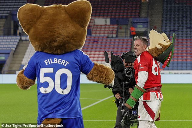 The Liverpool legend was in good spirits and shared a cheeky grin at Filbert the Fox afterwards