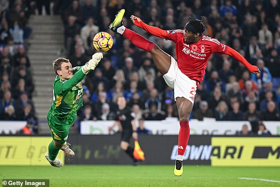 LEICESTER, ENGLAND - OCTOBER 25: Mads Hermansen of Leicester City punches the ball clear from Anthony Elanga of Nottingham Forest during the Premier League match between Leicester City FC and Nottingham Forest FC at The King Power Stadium on October 25, 2024 in Leicester, England. (Photo by Michael Regan/Getty Images)